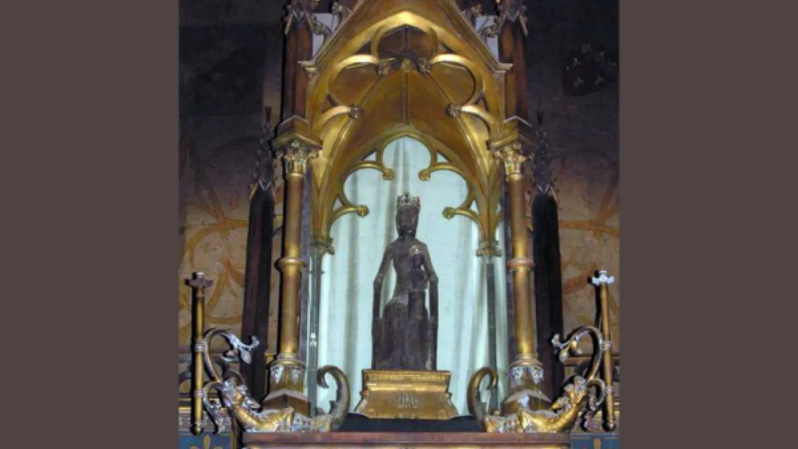 Photo of a black Madonna figurine on a church altar