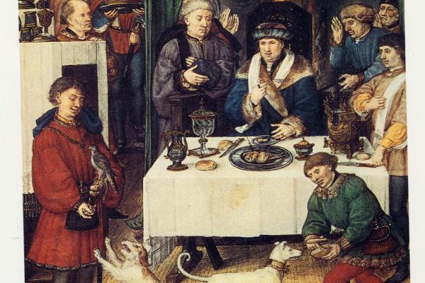 A painting from the medieval era with people around a table